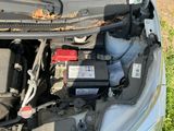 a car that has a battery in the hood of it