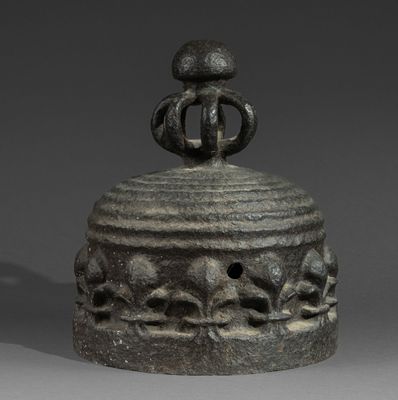 a small metal object with a bird on top of it