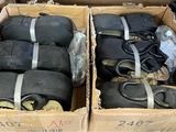 two boxes filled with black rope and a pair of scissors
