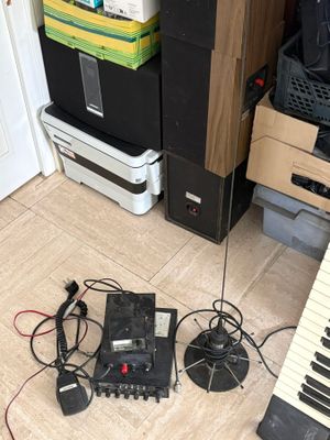 a keyboard, speakers, and other electronic equipment on the floor