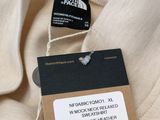 the north face logo on the back of a t - shirt