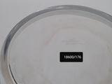 a glass bowl with a lid on a table