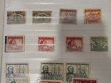 a picture of a collection of stamps on display in a glass case