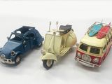 three toy cars that are sitting next to each other
