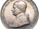 une image représentant une pièce d'argent sur laquelle figure le portrait d'un homme