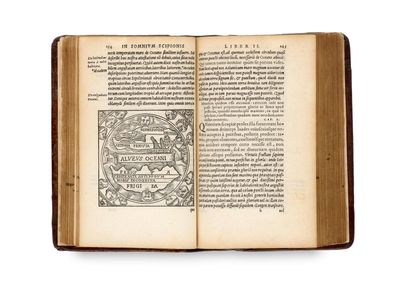 un livre ouvert avec l'image d'un homme et d'un chien