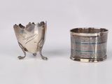 silver plated cup and spoon on a white surface