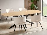 a table and chairs in a room with a rug on the floor