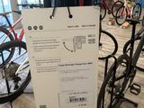 a sign on a bike stand in a bike store