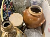 a box full of vases and other items sitting on a table