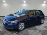 a blue volkswagen golf is parked on a checkered tile floor