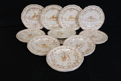 a lot of plates that are sitting on a black table