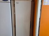 two white refrigerators in a kitchen next to each other