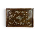 an image of a wooden tray with a floral design on it