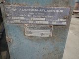 a sign on the side of a machine that is sitting on the ground
