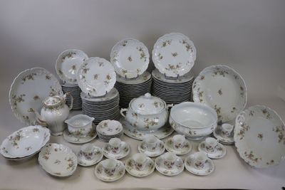 many different types of plates and bowls on the table