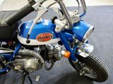 a blue and white motorcycle parked on a blue carpet