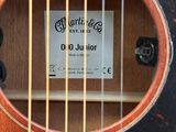 a label on the strings of a guitar that is in a case