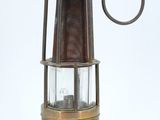 an old fashioned lantern with a hook on a white background