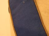 a close up of a mannequin torso with a blue and brown belt