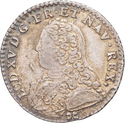 une pièce en argent avec l'image d'un homme de profil