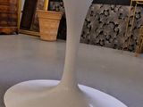 a white table with a glass top in a room