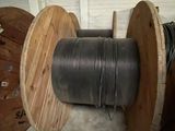 two spools and a reel of wire in a room