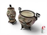 two vases with birds painted on them on a white background