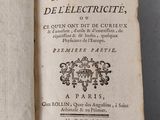 an open book with a black and white drawing on it