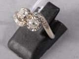 an image of a diamond ring on a black ring holder