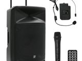 a close up of a speaker with a microphone and a remote
