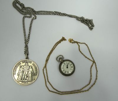 an image of a pocket watch and a coin on a chain