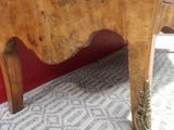 a wooden table with a drawer on top of it