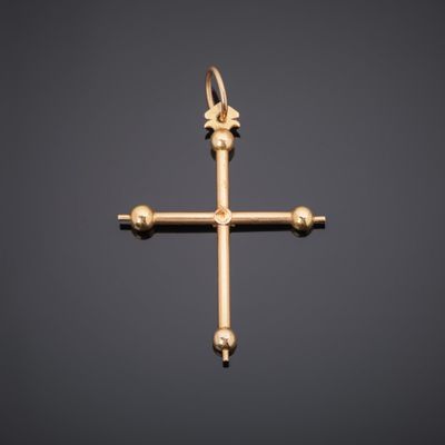 an image of a gold cross on a black background
