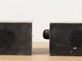 pair of black marble cufflinks on a wooden table