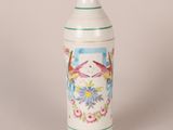 a white vase with birds and flowers painted on it