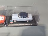 three different models of cars on display in a display case