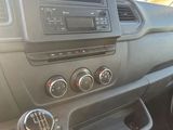 a dashboard of a car with a radio and other items in it