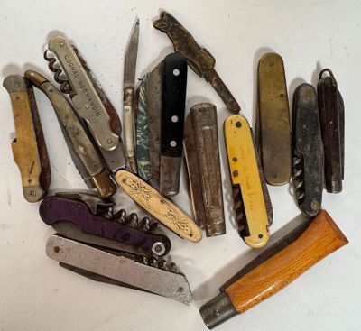 many different types of pocket knives on the table