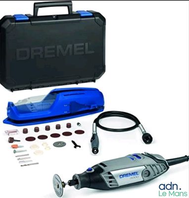 the dremel corded sander is in a case with tools