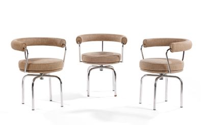 three chairs with arms and legs are sitting in front of a white background