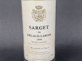 an image of a bottle of wine sitting on top of a table
