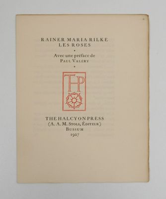 an open book with a picture of a cat in a window