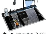a picture of a kitchen sink with a faucet, sink, and other kitchen accessories