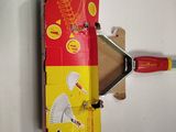 a cardboard box with a tool attached to it