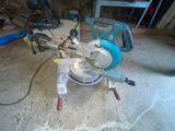 someone is using a circular saw to cut a piece of wood