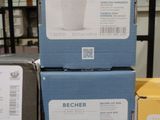 trois boîtes de café Becherer empilées les unes sur les autres