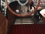 a steering wheel and dashboard of a car on display