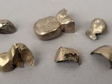several pieces of metal that are sitting on a table
