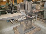 a machine that is sitting in a room with a lot of wood